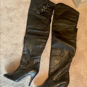 Thigh high black leather boots